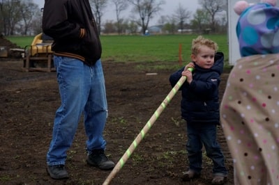 kid breaking ground