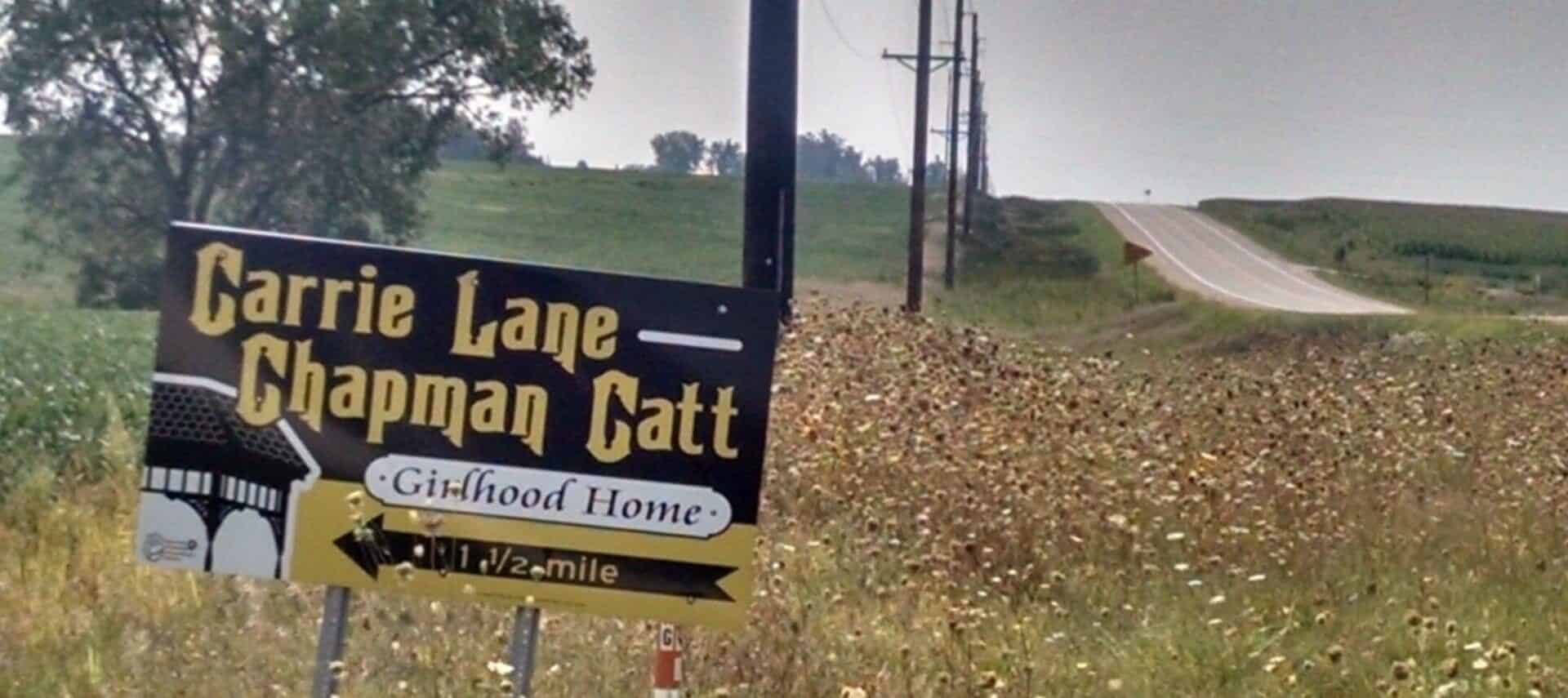 sign on country road pointing to Carrie Chapman Catt Girlhood Home