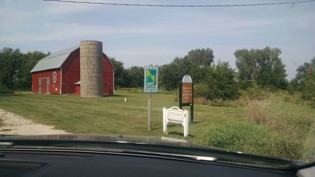 barn and signs at entrance of museum farmstead