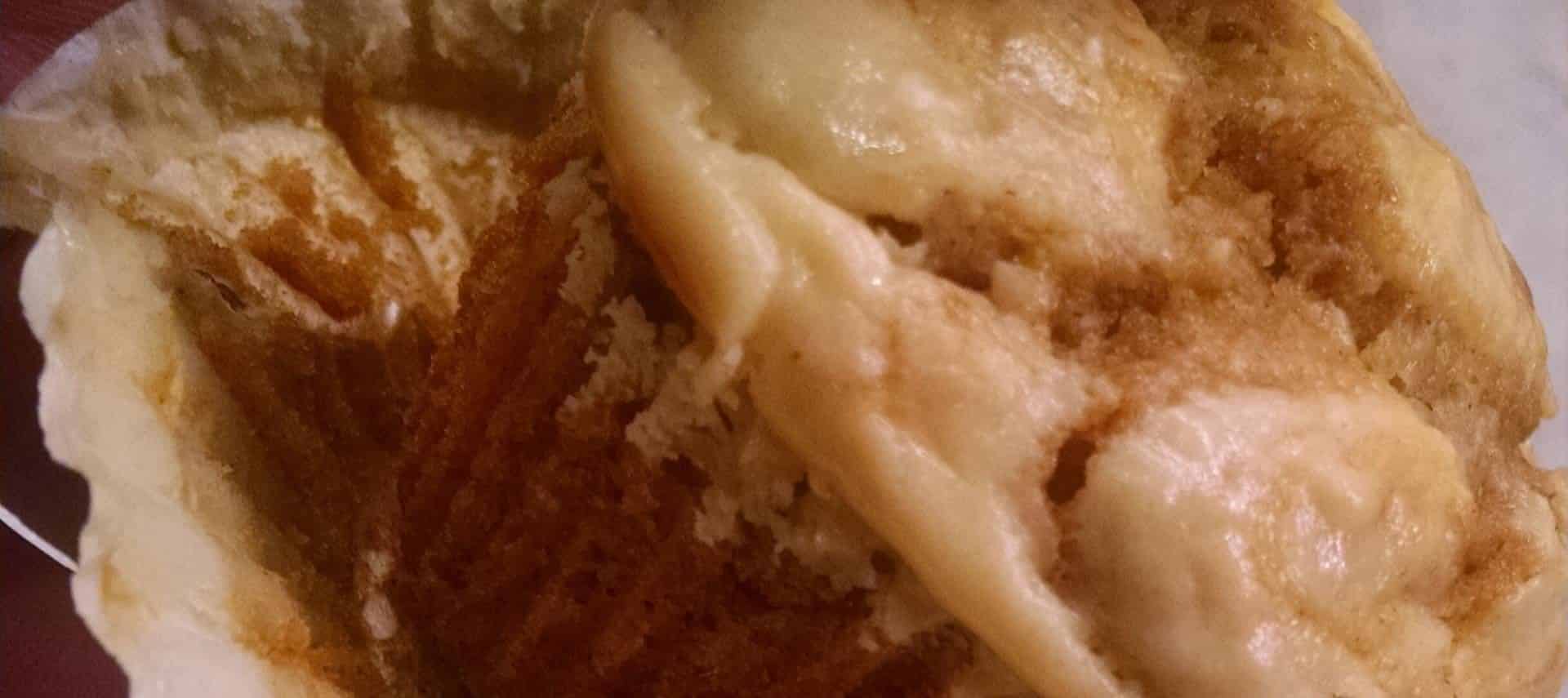 Close up view of pumpkin cream cheese muffin