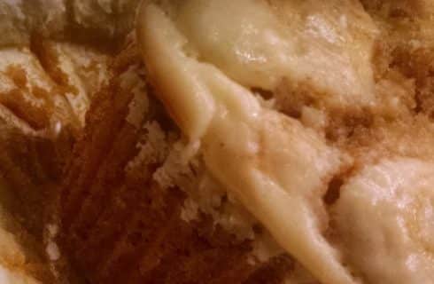 Close up view of pumpkin cream cheese muffin