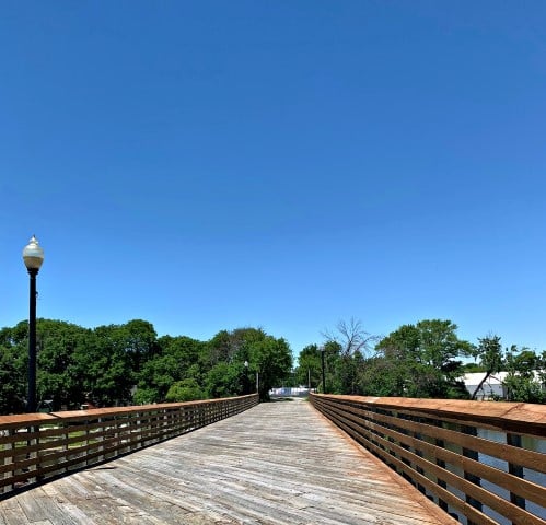 wooden bridge across a river